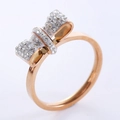 Elegant rose gold bow ring with shimmering crystal pavé stones on a sleek metal band - US 6 / Rose Gold