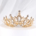 Elegant gold baroque crown with clear crystals and white beads on display stand - Handmade V-shape Gold Crown