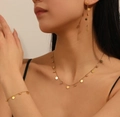 Detail of 18k gold plated stainless steel jewelry set with round coin pendants and zircons - Round Disc Zirconia Jewelry Set (B206-K511-H305)