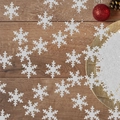 Macro detail of white glitter snowflake confetti on dark wooden table with festive ornaments - Silver Glitter Large Snowflake (50 Pcs/Pack)