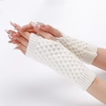 Detailed close-up of white cable knit texture on soft winter thermal arm warmers - White
