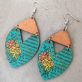 Detail of bohemian wooden earrings with turquoise faux-leather floral print and gold stripes - Turquoise Floral Style