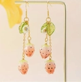 Detailed view of pink strawberry drop earrings with gold hooks and leaf accents - Short Gradient Pink Strawberry (FN1006-2)