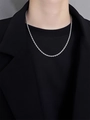 Silver twist chain necklace in titanium steel on male model wearing black suit - Silver