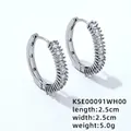 Macro detail of silver hoop earrings with square zircon pavé setting and sizing scale - White Zirconia
