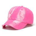 Detail view of hot pink washed denim baseball cap with vintage distressed ripped effects - Rose Pink