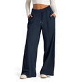 Detailed view of the elastic high waist with adjustable drawstring on blue wide-leg pants - Black Blue
