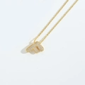 Chic gold necklace featuring a glittering F-shaped letter pendant encrusted with crystals - Letter F