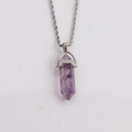 Hexagonal amethyst bullet pendant necklace with a silver twist chain on white background - Amethyst