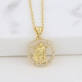 Macro shot of gold zodiac necklace with Virgo pendant and cubic zirconia on marble - Virgo