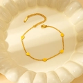 Detail showing the lobster clasp and S-STEEL engraved tag on golden teardrop bracelet - Gold Waterdrop Bracelet