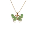 Golden butterfly pendant necklace with green and white enamel and colored gemstones - Green