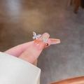 Detail of zircon butterfly ring with asymmetric double butterfly and open band design - Silver - Double Butterfly Zirconia