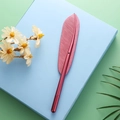 Creative pink metallic feather pen displayed on a blue base for student gift - 0.5mm / Red
