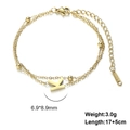 Double-layered golden stainless steel bracelet featuring capital letter K pendant charms - Letter-K / Gold