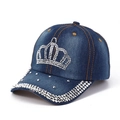 Detail of the rhinestone crown motif and sparkling studs on the blue denim baseball cap - Adjustable / Dark Blue Denim