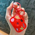 Red cartoon dinosaur projection camera keychain with lucky text detail - Red