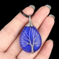 Blue agate waterdrop pendant with silver wire-wrapped tree of life on black cord - Dyed Blue Jade