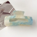 Detailed close-up of gradient marble resin hair claw clip in blue and yellow hues - 10.5cm Rectangular / Starry Yellow