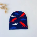 Close-up of baby knitted beanie with colorful dinosaur patterns on navy blue fabric - Navy Blue Dinosaur (5061509487927)