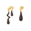 Asymmetric Y2K earrings in gold and black featuring a melted lava fluid droplet design - Black