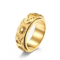 Gold rotating stainless steel spinner ring with sun, moon, and star relief details - Size 6 / Gold