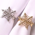 Elegant snowflake napkin rings in gold and silver metal finish for festive tables - Red Green Snowflake