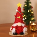 Red Christmas gnome ornament with star hat, white beard, and wooden base for home decor - Red Christmas Tree Gnome