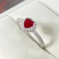 Elegant silver ring featuring a vibrant red heart-shaped gemstone and cubic zirconia - Platinum + Red Zircon