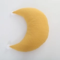 Close-up of yellow moon-shaped nursing pillow with white pom-poms and quilted texture - Yellow Pom-pom Moon Pillow