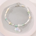 Bohemian multi-layer necklace featuring sea turtle, starfish, and turquoise bead accents - Necklace Shell (3174)