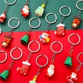 Set di portachiavi natalizi con Babbo Natale e Renna su sfondo festivo rosso e verde - Serie di Natale