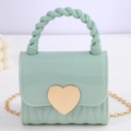Mini mint green jelly handbag with golden heart clasp and twisted handle details - Green