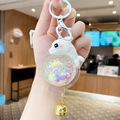 Witte dolfijn sleutelhanger met glittervloeistofbal en gouden belletje accessoire - Dolfijn-Wit