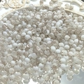 Macro shot of 10mm white and tea-colored ice-crackle glass beads for DIY jewelry making - 8mm Semi-white Khaki