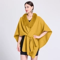 Bright yellow knit poncho with a faux rabbit fur collar and decorative pompom detail - Yellow