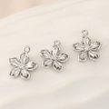 Macro detail of three 18k copper flower pendants with sparkling zircons and silver finish - PJ0108-Silver (Five-Petal Flower)