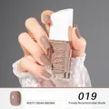 Peelable nude nail polish in Misty Cream-Brown color on elegant hand with 10ml bottle - 19#Misty Cream-Brown