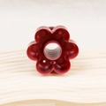 Deep red flower-shaped donut mold made of durable plastic on a wooden base - Red Flower Donut