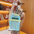 Detail view of mini milk tea cup calculator keychain with measurement specifications - Blue