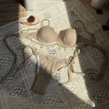 Detail of earth-tone ribbed bikini set with shell charms and bohemian crochet lace trim - S / Camel