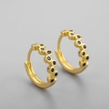 Close-up of gold hoop earrings featuring embedded black cubic zirconia stones in a row - Black Rhinestone Irregular Hoop Gold