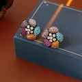 Macro shot of vintage floral earrings with colorful zircon stones on a dark jewelry box - Silver Earring Post - Colorful