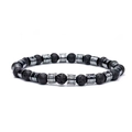 Macro shot of 8mm black lava stone beads with silver-tone cylindrical metal spacers - 6mm Hematite & Lava