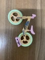 Miniature balance bike toy keychain in beige and pink with green wheels for decor - Large / Green Tire