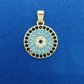 Golden Evil Eye pendant with black and blue stones on dark blue fabric background - Gold Round Evil Eye Style (779)