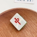 Creative Mahjong red dragon hair clip in polished resin with a natural wood background - Mahjong Red Zhong