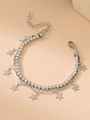 Macro shot of silver double-layered bracelet with crystal stars and cross pendants - Star / Silver