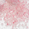 Macro shot of transparent glass beads with red swirl patterns for jewelry making - 10mm Spotted Beads / Red