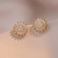 Macro shot of sparkling sunflower stud earrings with zircon petals on silk fabric - E0675 Gold --1